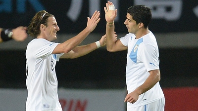 Форлан (слева) и Суарес